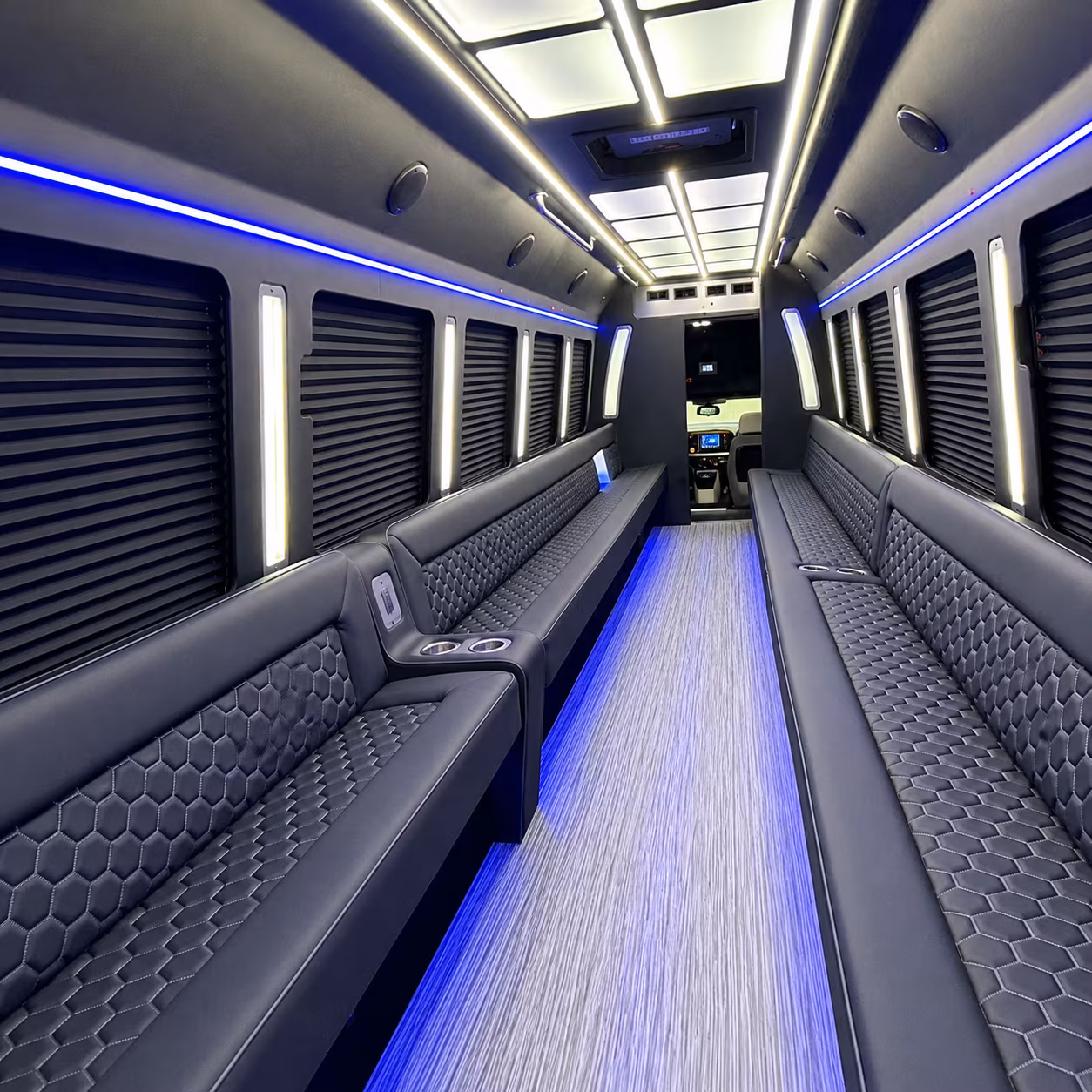 Wedding guests seated inside a party bus serving Dallas